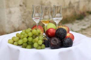 palinka tulip glass and fruit